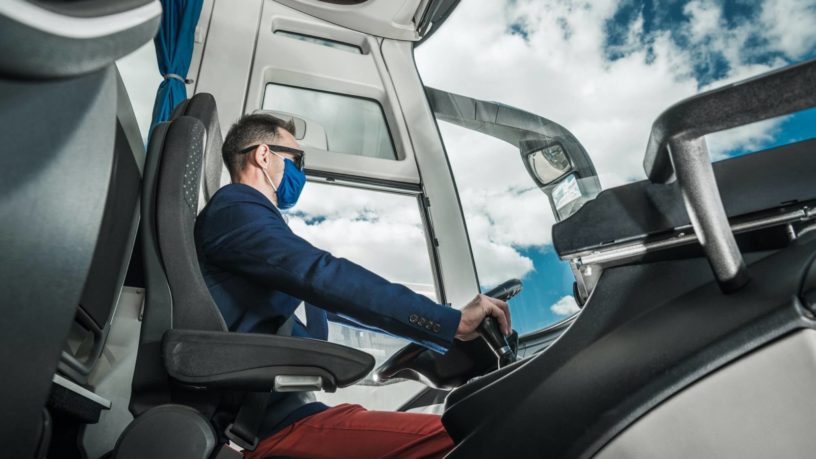 Shuttle Coach Bus Driver Inside the Modern Vehicle