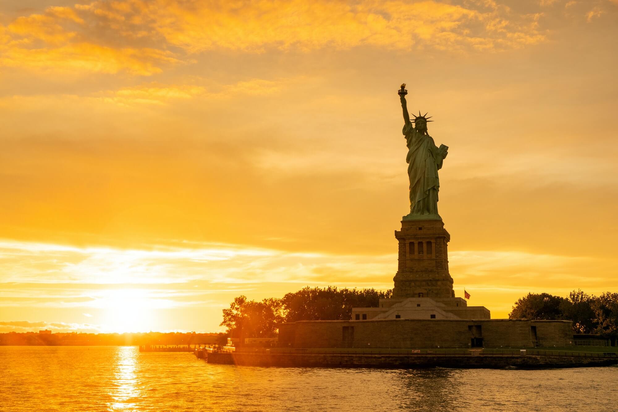 The Statue of Liberty at New York city during sunset